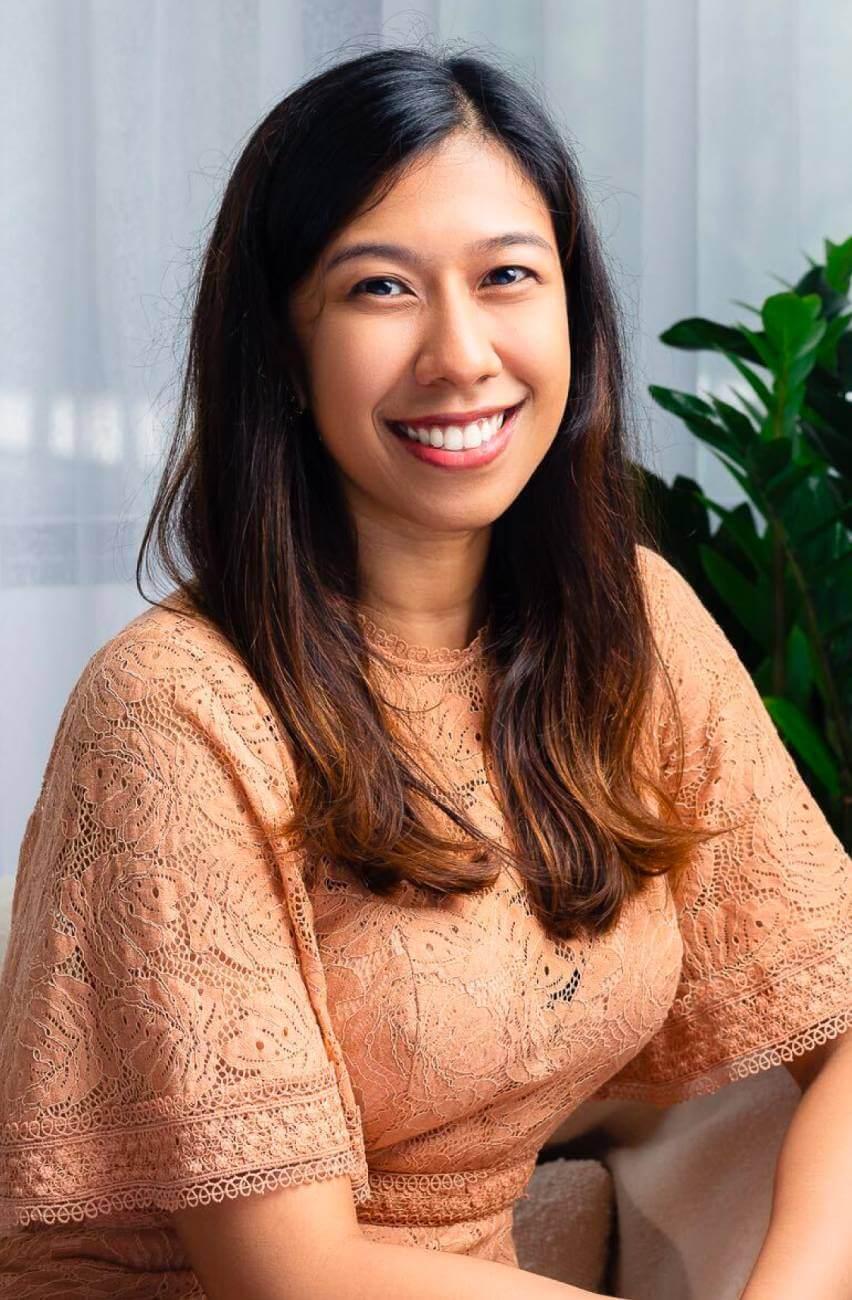 Smiling therapist conducting an online session